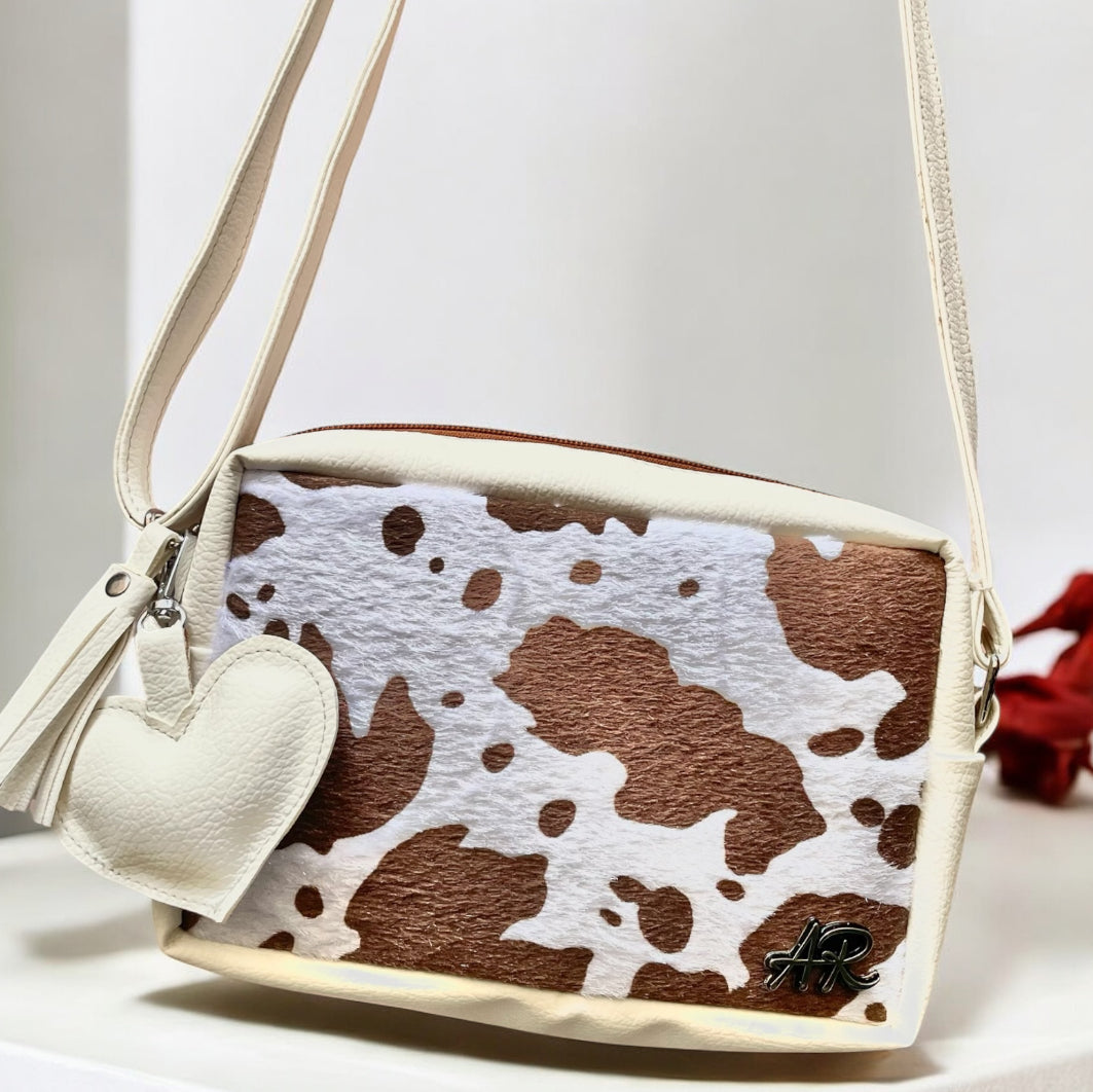 Bandolera Cow print + Charms
